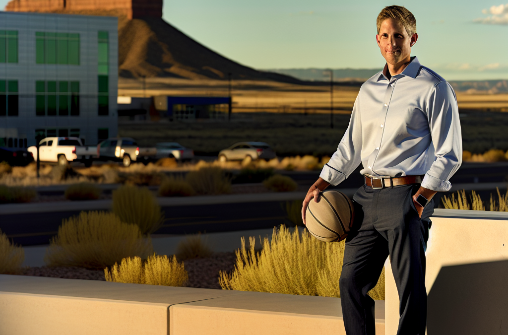 Business leader in Grand Junction holding a basketball outdoors at golden hour, representing motivation and sports mindset